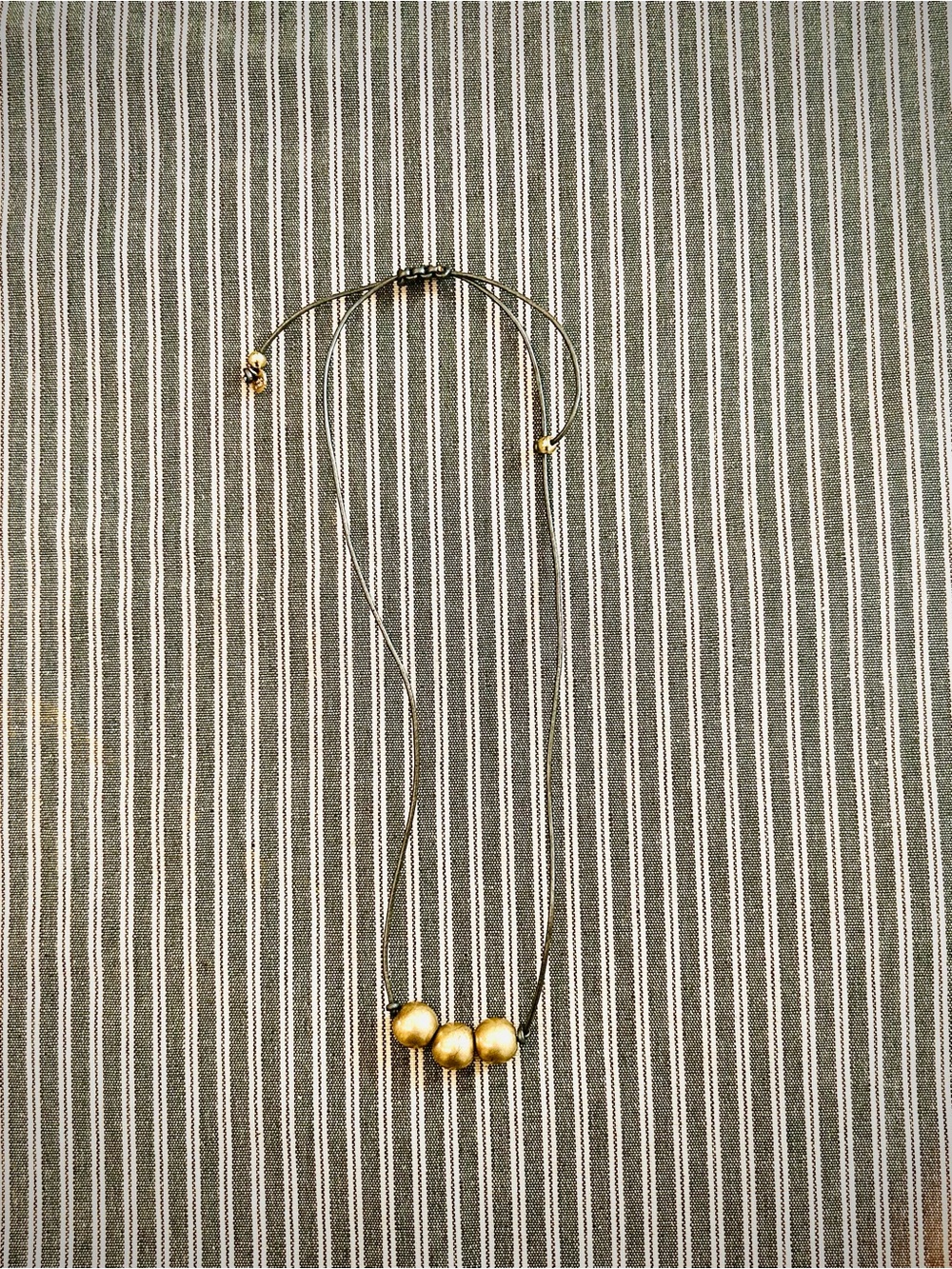 Adjustable Gold Bead Necklace on Black Cord